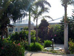 The beautiful, tropical gardens of Three Dolphins Villa, Long Bay Beach, Providenciales (Provo), Turks and Caicos Islands