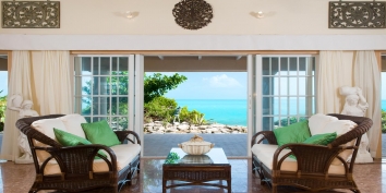 The open plan living area has large French doors and great views of the Caribbean Sea