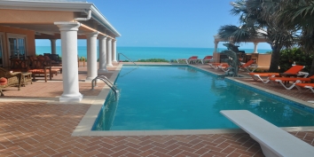Dive in to the cooling 42 feet private swimming pool of this Caribbean villa rental.