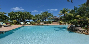 A beautiful 2 bedroom villa with lagoon-style swimming pool located directly on a stunning Caribbean beach!