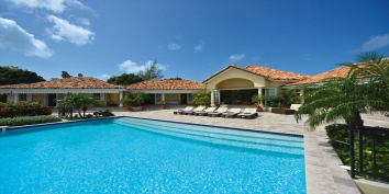 An enchanting neoclassical Caribbean island retreat with 4 bedrooms, heated infinity-edge swimming and fantastic views!