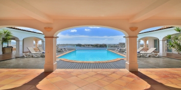 The gorgeous pool and spacious deck of this Saint Martin vacation villa rental.