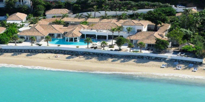 A luxurious, spacious, 6 bedroom, 6 bathroom, beachfront villa with huge swimming pool and stunning Caribbean sunsets!