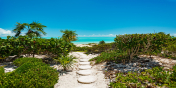 Only a few steps to the 3 mile stretch of beautiful unspoiled beach at Long Bay, Turks and Caicos Islands.
