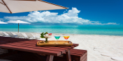 Cocktails on the beach during your vacation at Beach Villa Shambhala, Turks and Caicos Islands.