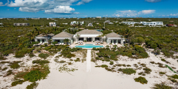 This Turks and Caicos luxury villa rental is located right on Long Bay Beach.
