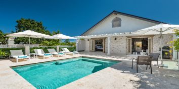 The swimming pool and deck at Callaloo Cottage, Providenciales, Turks and Caicos Islands.