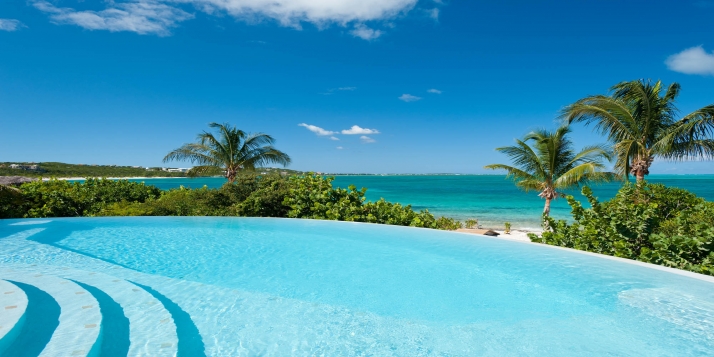 Enjoy gorgeous Caribbean views from this 5 bedroom villa with infinity edge swimming pool.