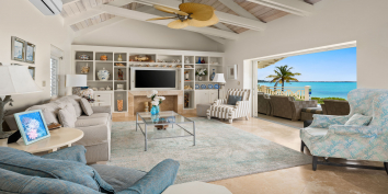 The open concept living room and kitchen at Turtle Beach Villa, Grace Bay Beach, Providenciales (Provo), Turks and Caicos Islands.