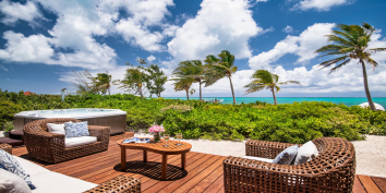 The almost beachfront, outdoor lounge area wth hot tub at Conch Beach Villa, Turks and Caicos Islands.