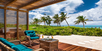 Relax in the shaded area of the Conch Beach Villa beach deck.