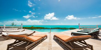 The spacious swimming pool deck of Conched Out villa, Long Bay Beach, Providenciales (Provo), Turks and Caicos Islands.