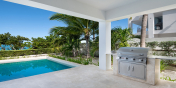 There is a BBQ on the covered pool deck of this Turks and Caicos villa rental.
