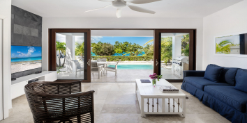 Sea Edge Villa features luxurious interiors across two levels of living space, multiple terraces and breathtaking vistas of Grace Bay and Turtle Cover Marina.