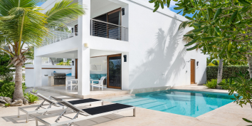 Dip your feet into your private, freshwater swimming pool at Water Edge Villa, Grace Bay Beach, Providenciales (Provo), Turks and Caicos Islands.