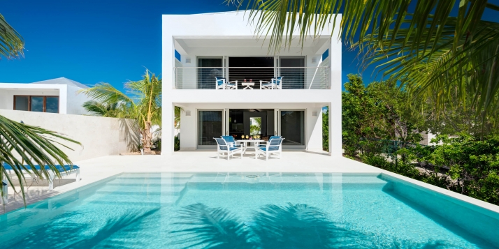 A luxurious, modern, one bedroom villa with private swimming pool and partial views of the marina and sea.
