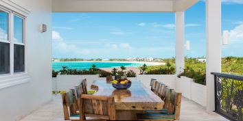 This Turks and Caicos luxury villa rental has spaces for dining indoors or outdoors.