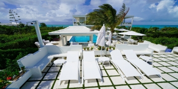 This Turks and Caicos luxury villa rental has a spacious swimming pool terrace for soaking up the tropical sunshine.