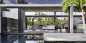 This Caribbean luxury villa rental has a heated swimming pool surrounded by a wooden deck.