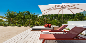 The private beach decks are just beyond the infinity edge swimming pool at the Beach Enclave Long Bay Beach Houses, Turks and Caicos Islands.