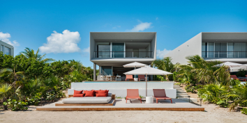 The Beach Enclave Long Bay Beach Houses redefine “beach house” with contemporary luxury.