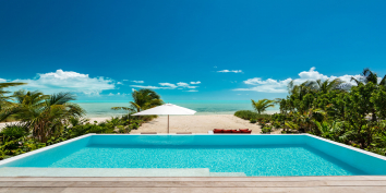 The infinity edge swmming pool is right on Long Bay Beach, Turks and Caicos Islands.