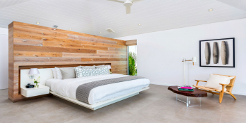 The grand master suite of this Turks and Caicos luxury villa rental has a king size bed.