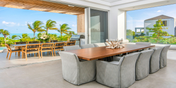 The dining area in the great room of Beach Enclave Long Bay Villa 3, Turks and Caicos Islands.