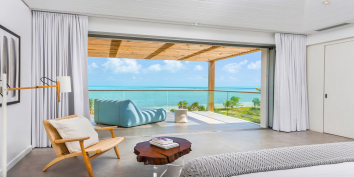 The grand master suite of BE Long Bay Villa 3 is spacious and has a private terrace with stunning views of Long Bay Beach.