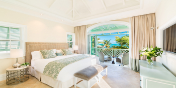 An upper level junior master suite with sea view at The Villas at The Shore Club, Turks and Caicos Islands.