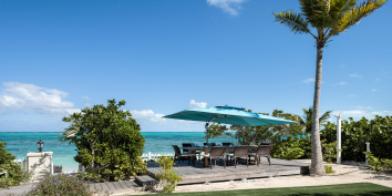You could have lunch almost on the beach at this Turks and Caicos luxury villa rental.