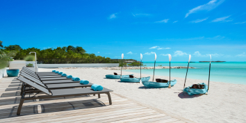 The beachfront deck of villa Emerald Bay, Providenciales, Turks and Caicos Islands.