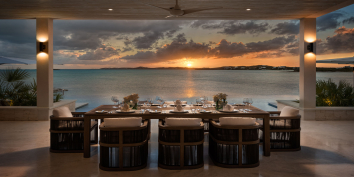 Watch the sun set while dining at villa Emerald Bay, Providenciales, Turks and Caicos Islands.
