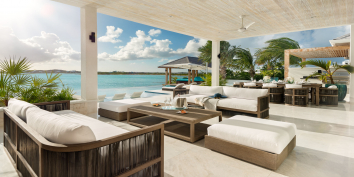 This fully staffed Turks and Caicos villa rental also has an outdoor living area.
