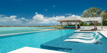 This fully staffed Turks and Caicos villa rental has a large, heated swimming pool.