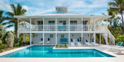 The main house is a classically Caribbean-style villa at Grace Too, Grace Bay Beach, Providenciales (Provo), Turks and Caicos Islands.