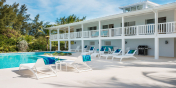 This Turks and Caicos villa rental has a classic, Caribben-style with wrap-around balcony.