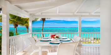 This Turks and Caicos villa rental has areas for indoor and outdoor dining.