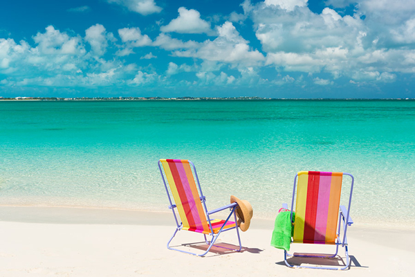 Beach chairs on Grace Bay Beach, Turks and Caicos Islands.